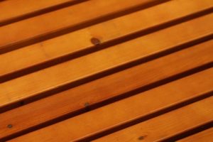 A close up of the wood slats on a bench